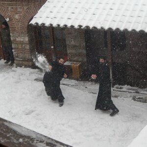 orthodox-monks-playing-in-the-snow-on-mount-athos-greece-v0-02os9t3icoxe1.jpg